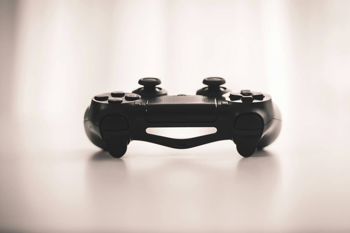 Close-up of top pc gaming controllers highlighting hall effect triggers and modular components